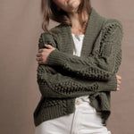 a traditional Irish Cashmere Aran Cardigan Sweater with Blackberry Stitch in Green