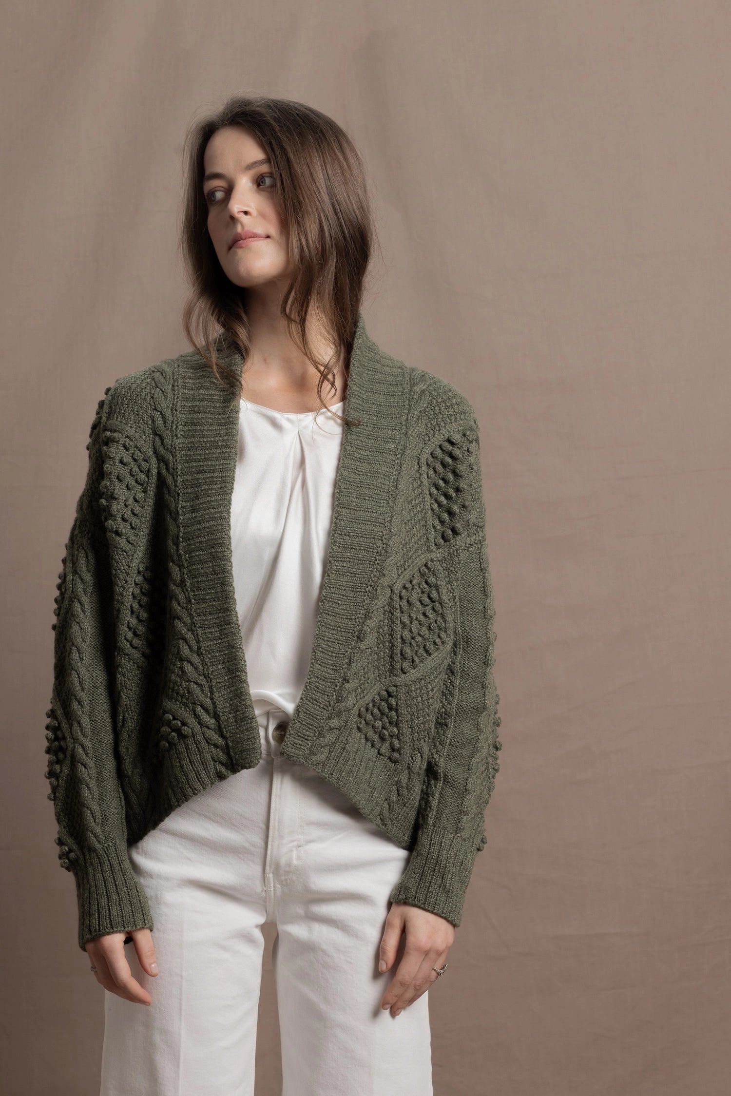 a traditional Irish Cashmere Aran Cardigan Sweater with Blackberry Stitch in Green
