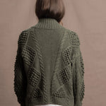 a traditional Irish Cashmere Aran Cardigan Sweater with Blackberry Stitch in Green