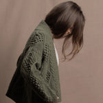a traditional Irish Cashmere Aran Cardigan Sweater with Blackberry Stitch in Green