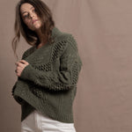 a traditional Irish Cashmere Aran Cardigan Sweater with Blackberry Stitch in Green