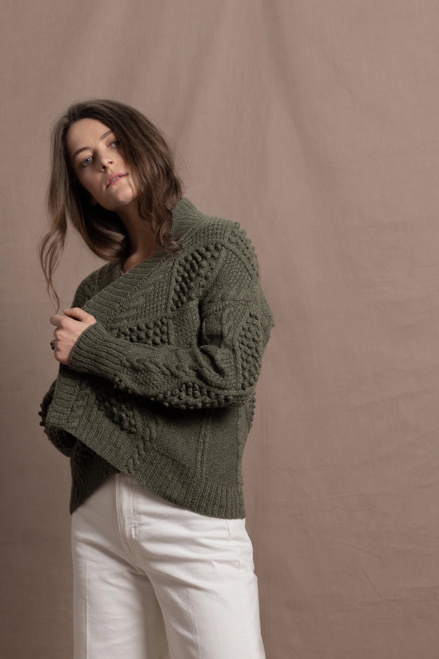 a traditional Irish Cashmere Aran Cardigan Sweater with Blackberry Stitch in Green