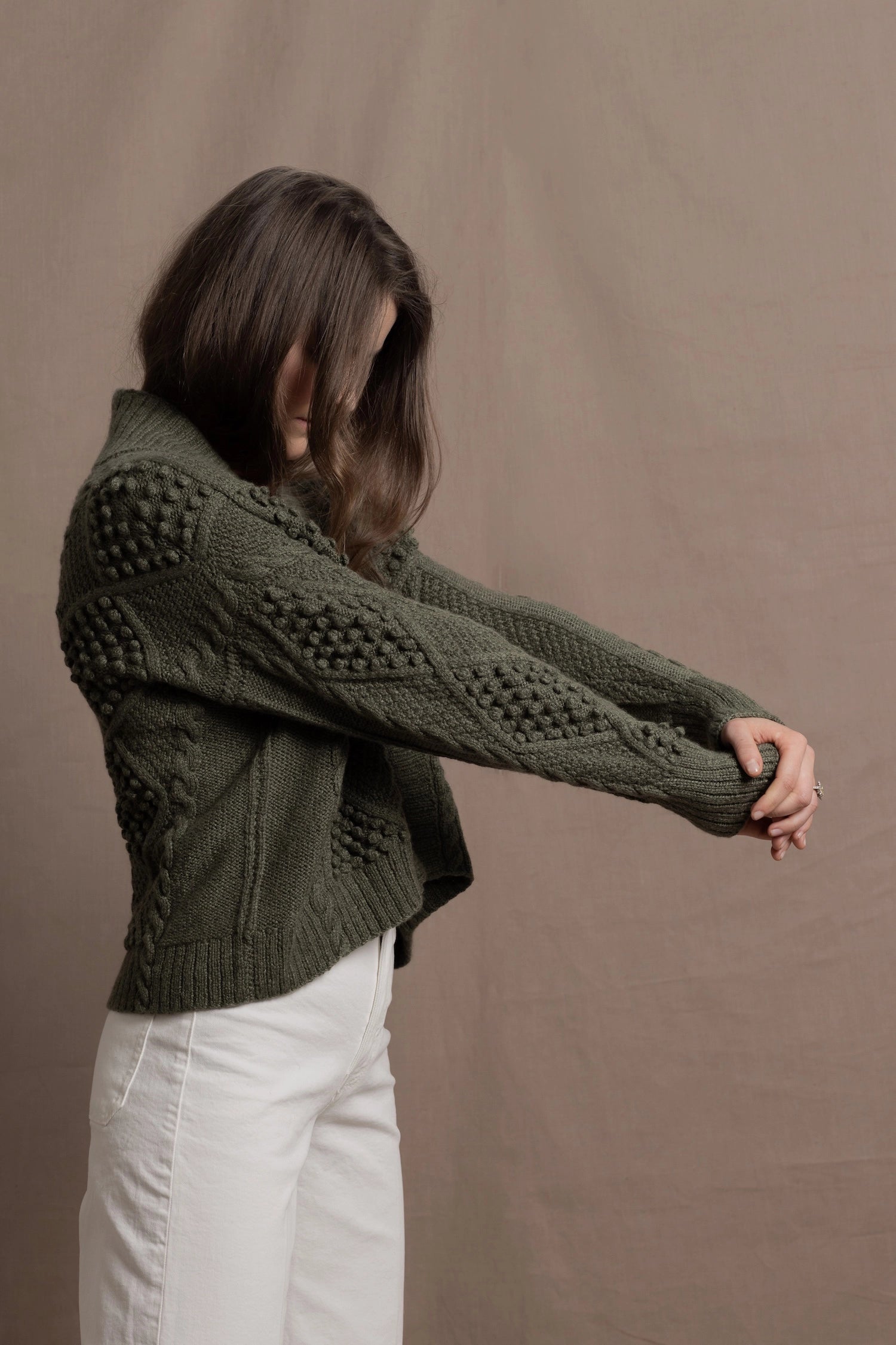 a traditional Irish Cashmere Aran Cardigan Sweater with Blackberry Stitch in Green