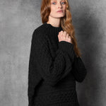 Redhead lady wears pure cashmere aran sweater from Ireland in black