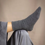 woman wearing cashmere socks in dark grey