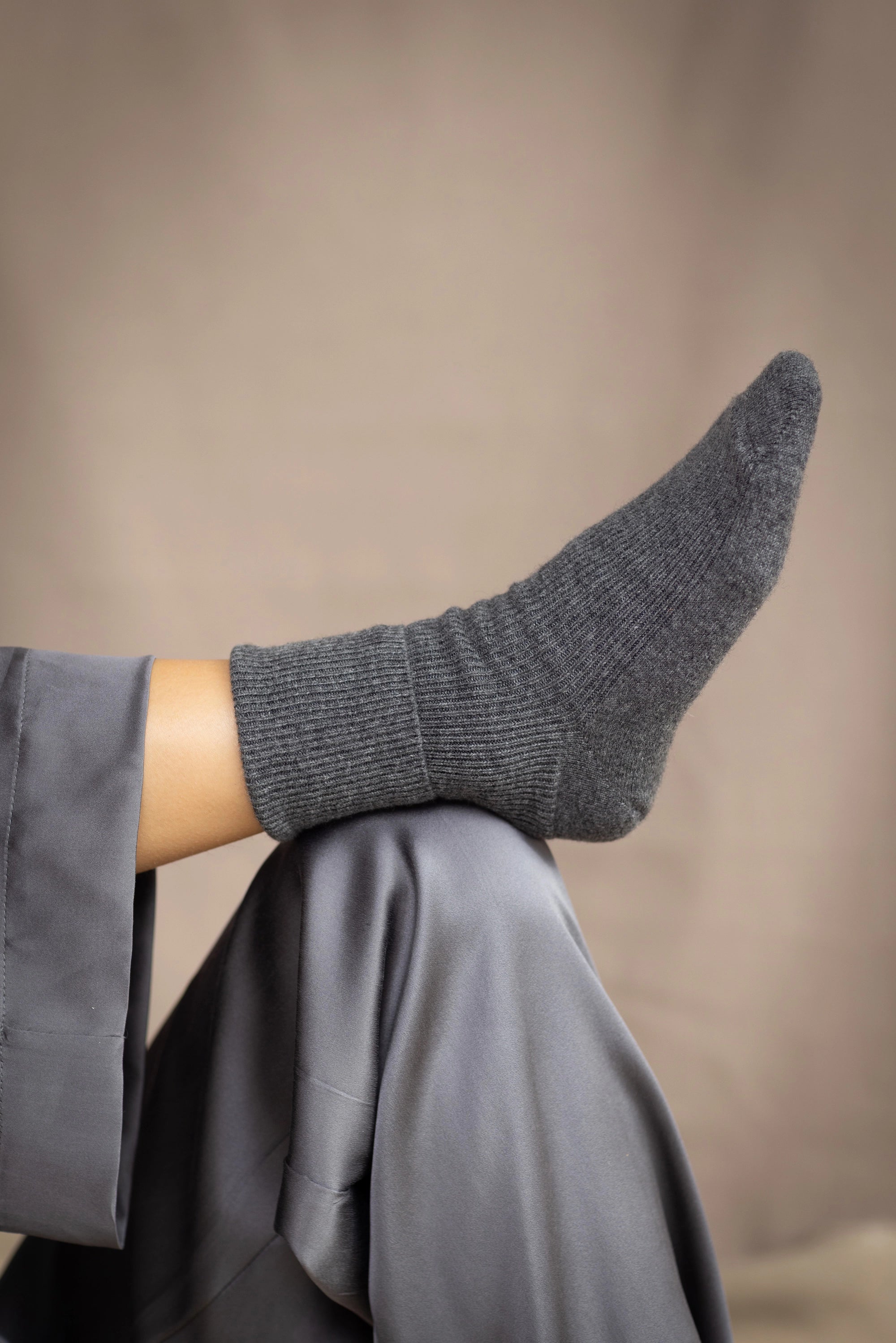 woman wearing cashmere socks in dark grey