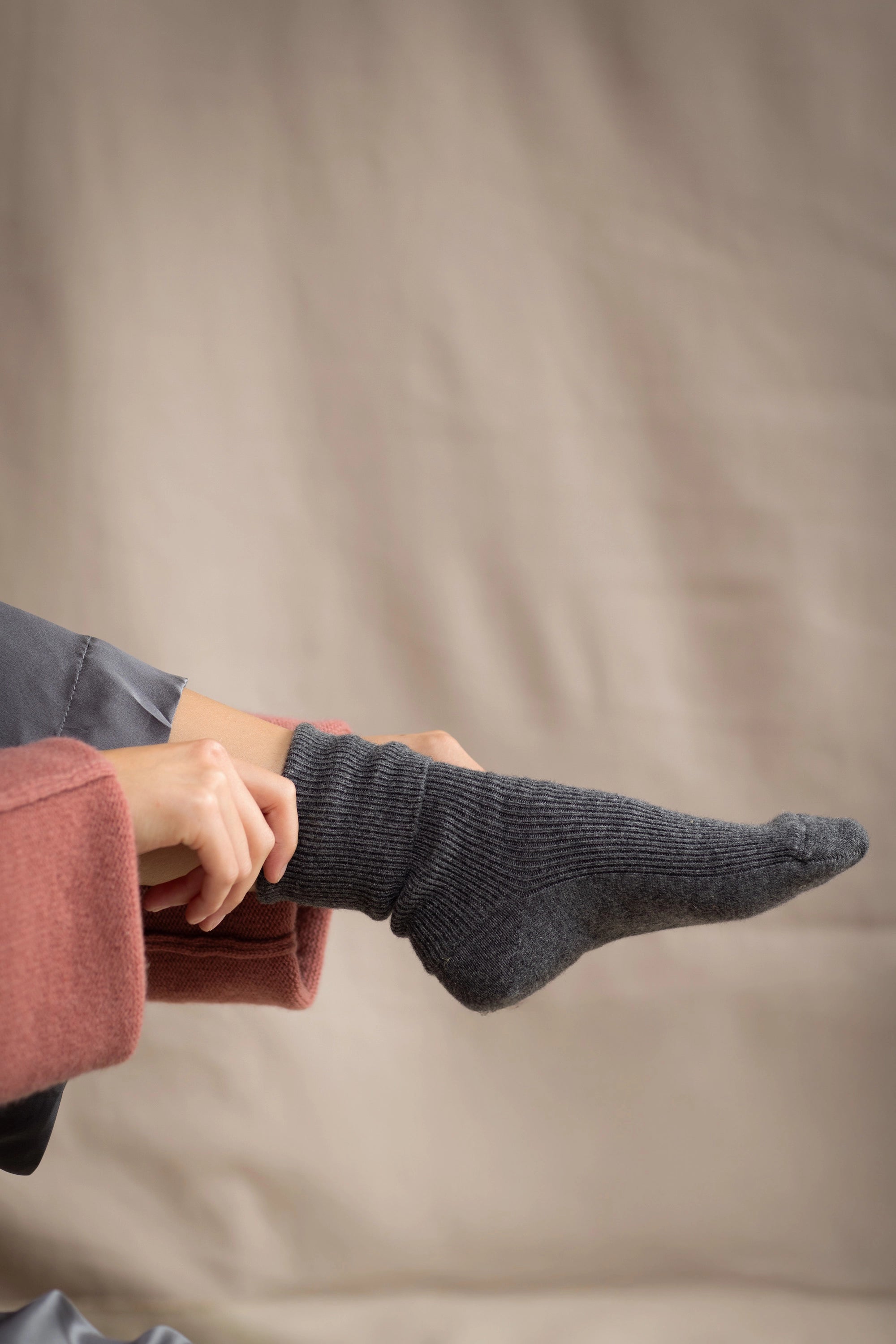 woman wearing cashmere socks in dark grey