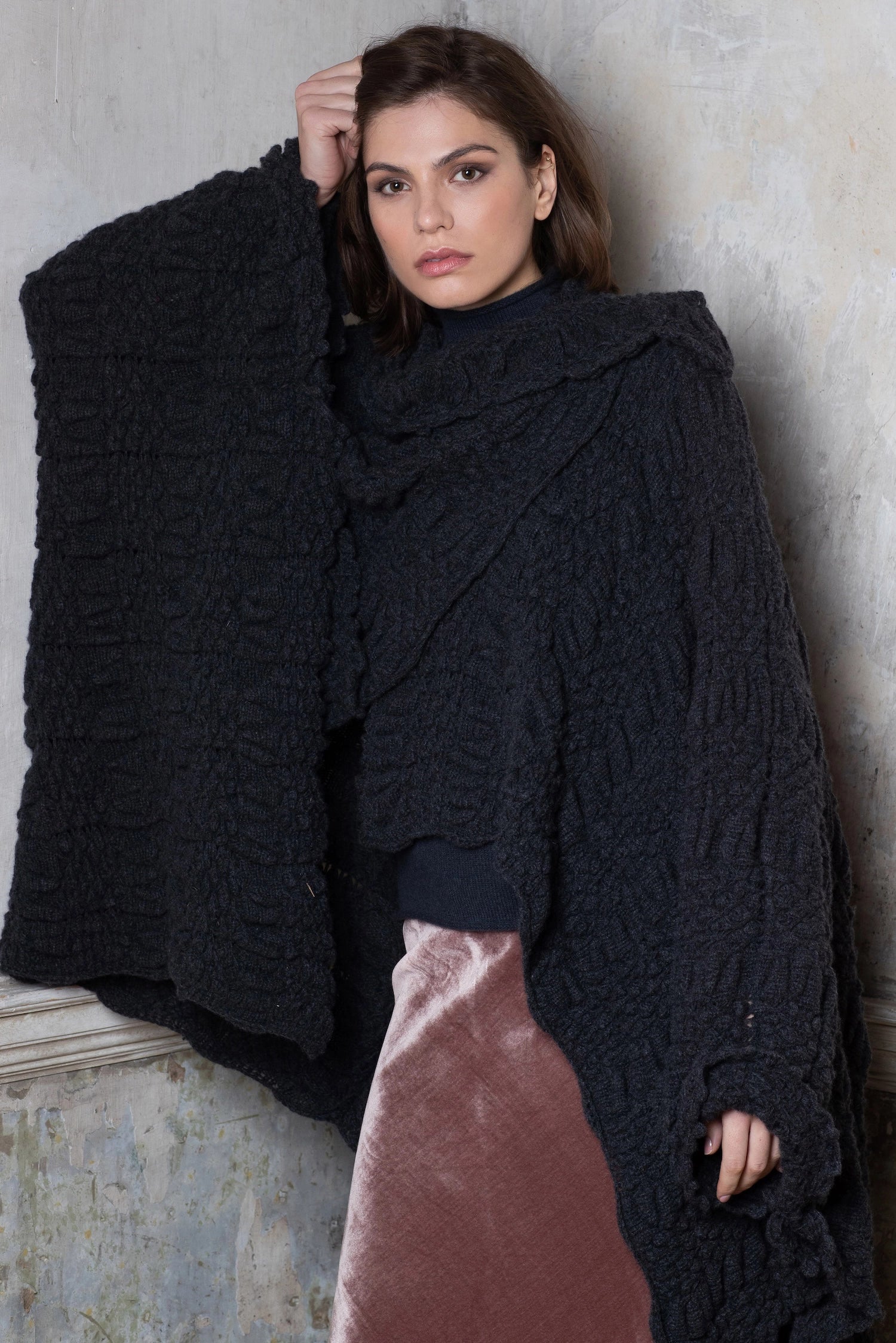 woman wearing a knitted cashmere cape