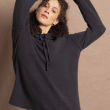 lady wears oversized pure cashmere hoodie sweater in grey blue colour