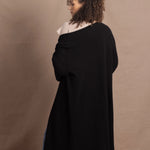 Lady wears luxury cashmere tee sweater in beige with long cashmere kaftan coat over top