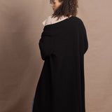 Lady wears luxury cashmere tee sweater in beige with long cashmere kaftan coat over top
