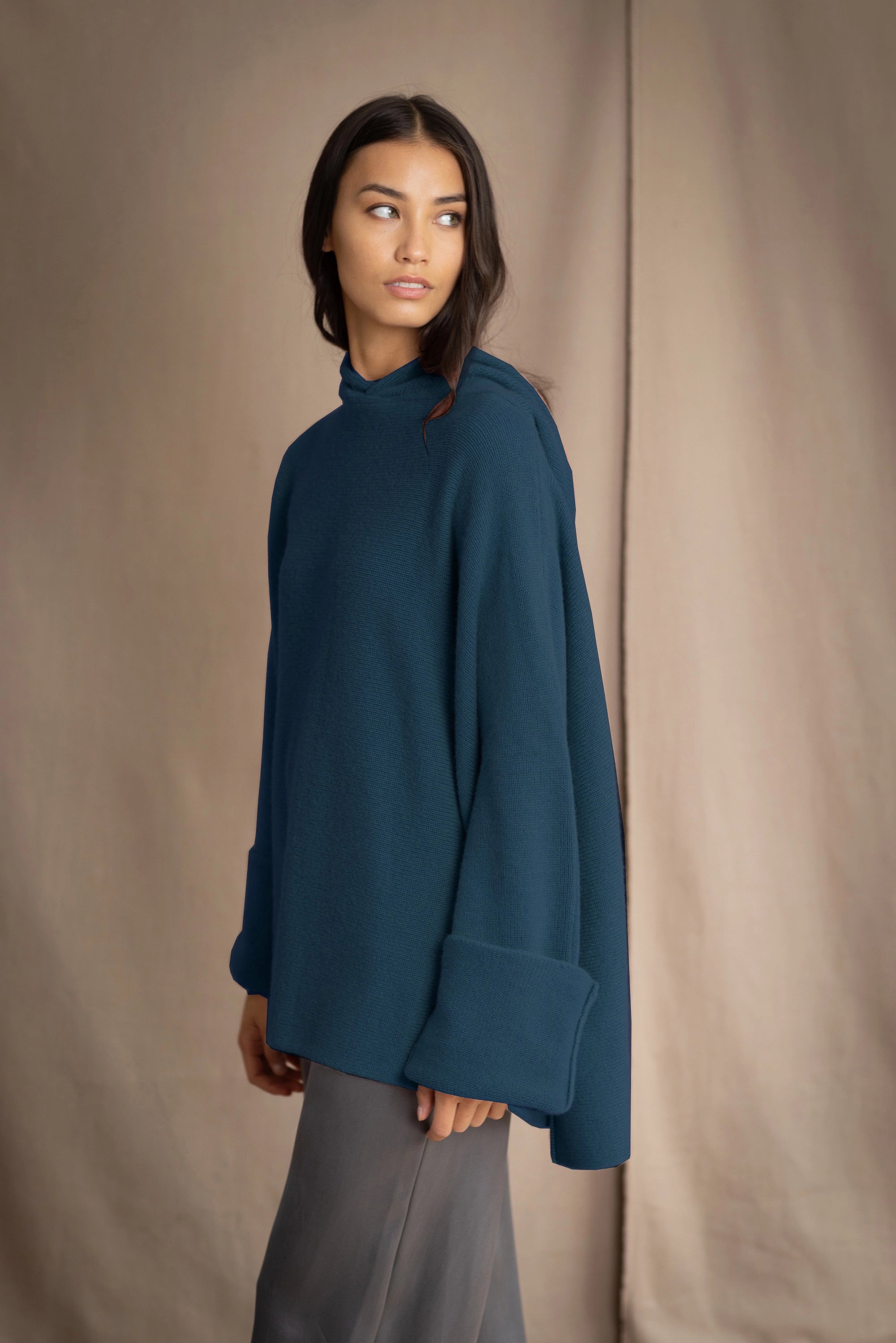 woman wearing oversized teal blue cashmere sweater