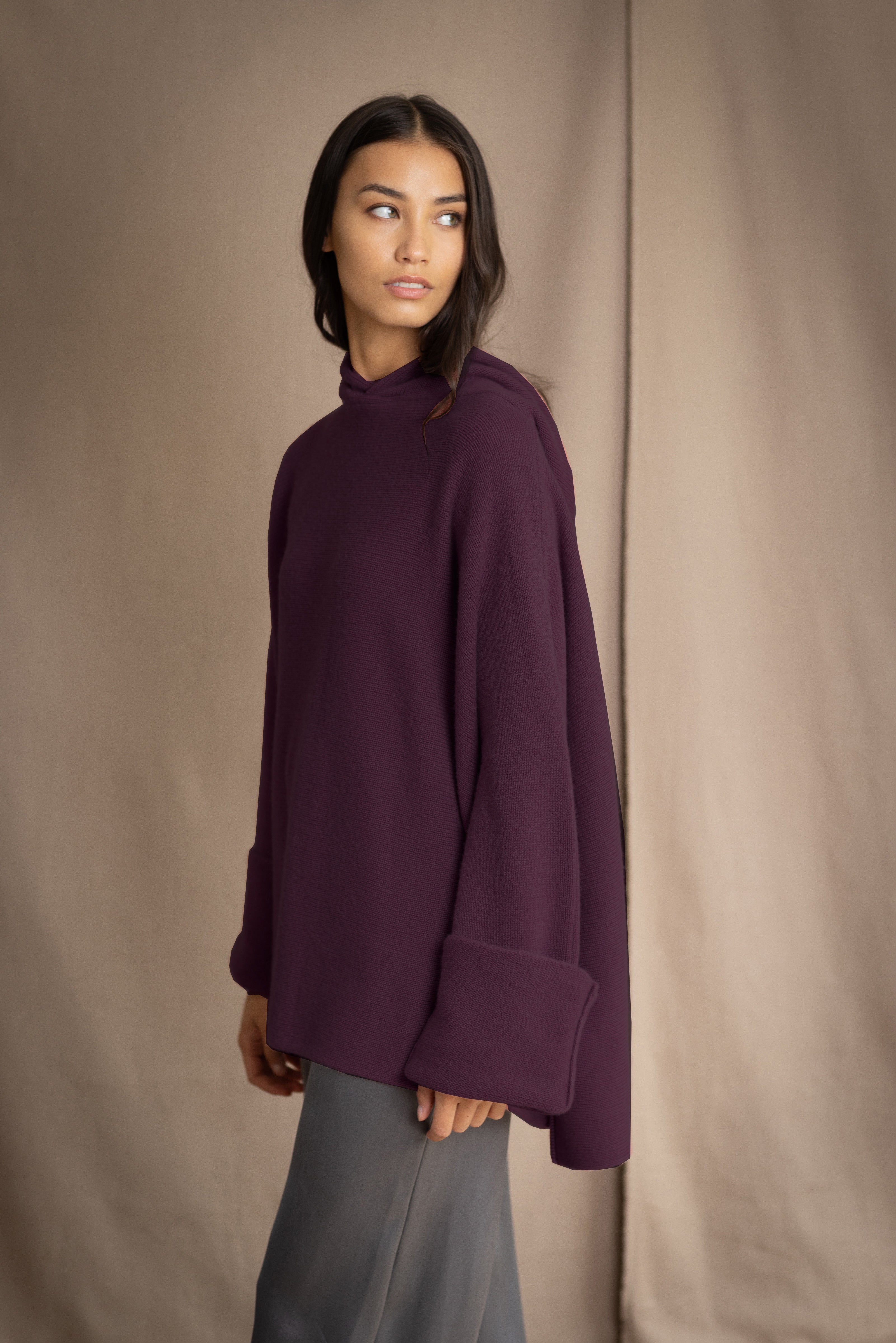 Woman wearing an oversized purple cashmere sweater