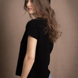 lady standing with 100% cashmere tee short sleeve sweater in black
