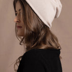 lady wearing luxury cashmere beanie hat in beige