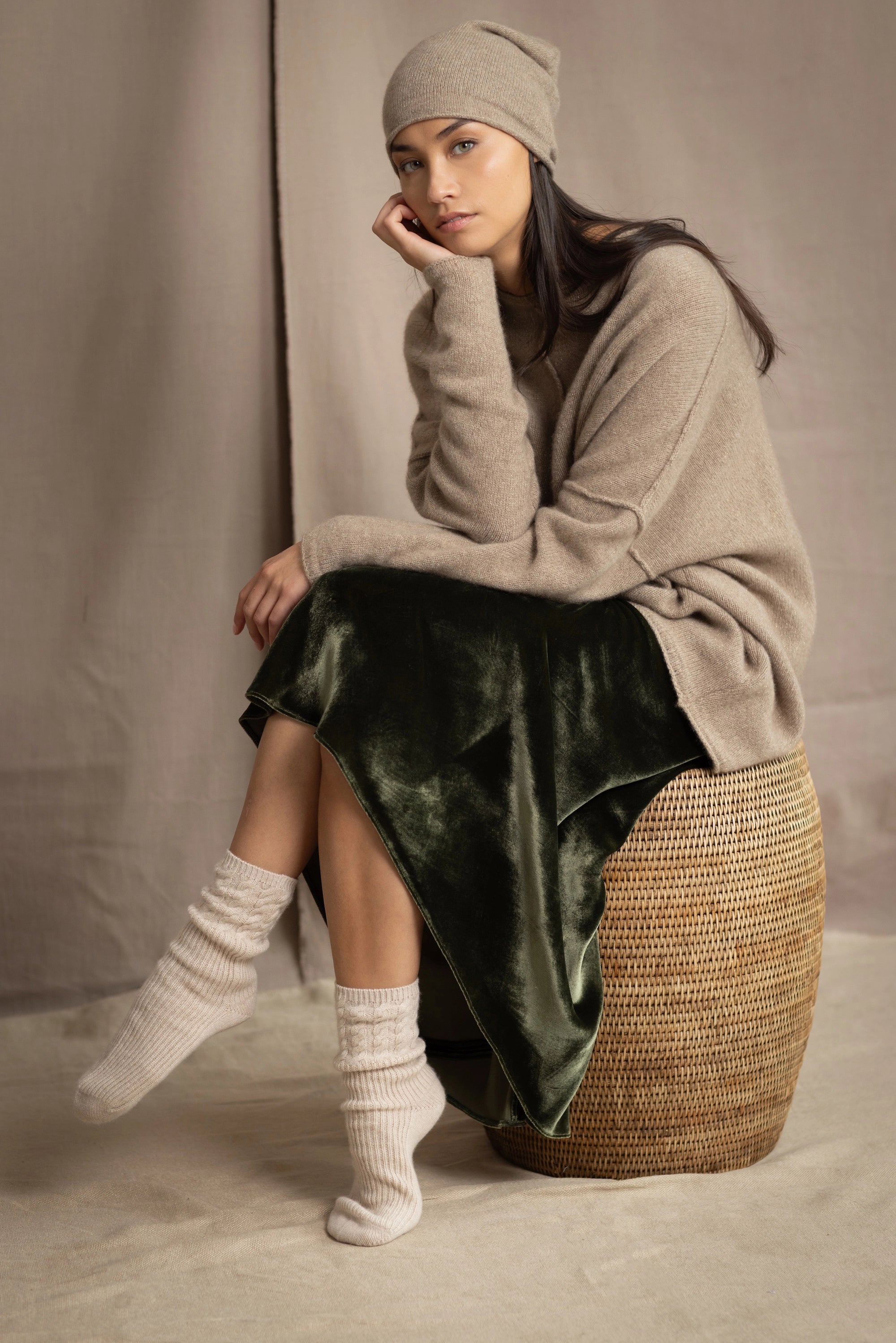 beige cashmere socks with cable detail around the ankle