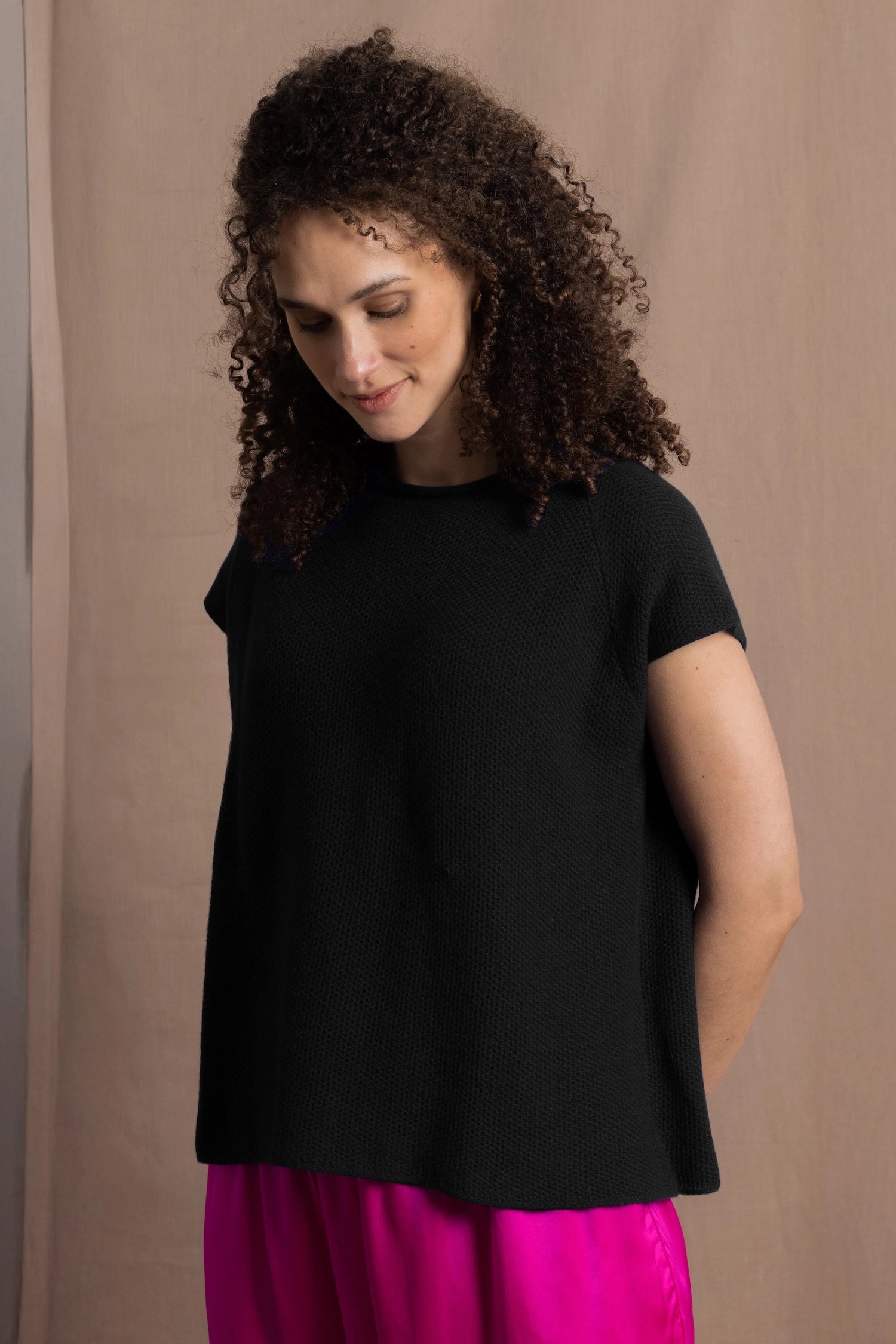 100% Cashmere Tee Sweater in Black worn with bright neon pink silk trousers