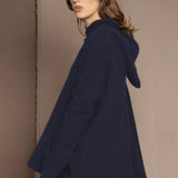 woman wearing oversized cashmere sweater in blue