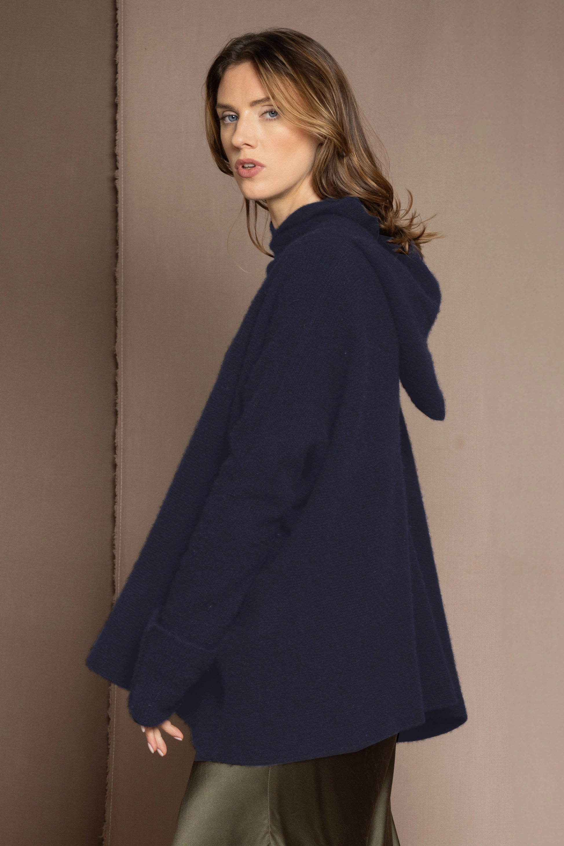 woman wearing oversized cashmere sweater in blue