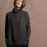 An authentic Irish Cashmere Aran Turtleneck Sweater in Charcoal Grey
