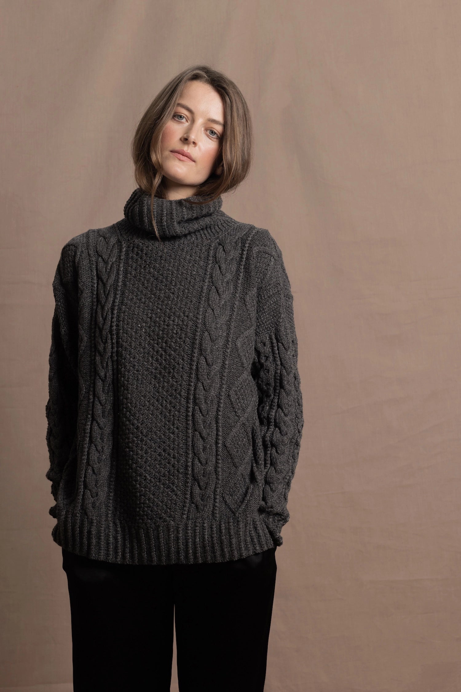 An authentic Irish Cashmere Aran Turtleneck Sweater in Charcoal Grey