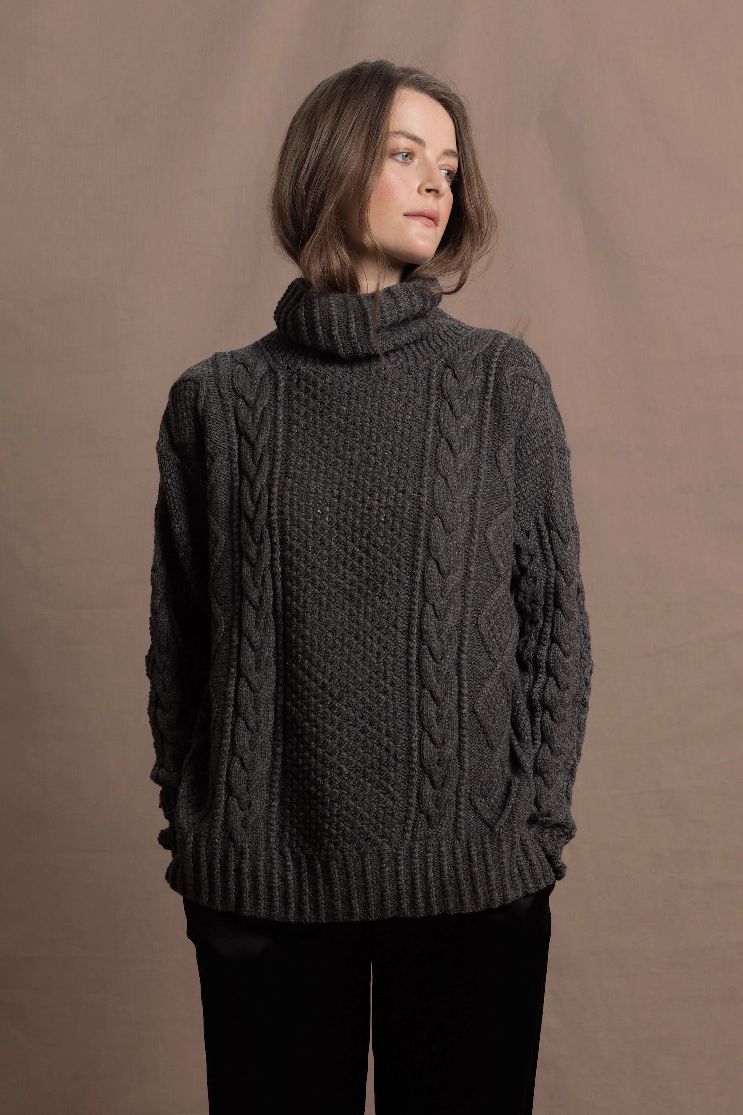 An authentic Irish Cashmere Aran Turtleneck Sweater in Charcoal Grey