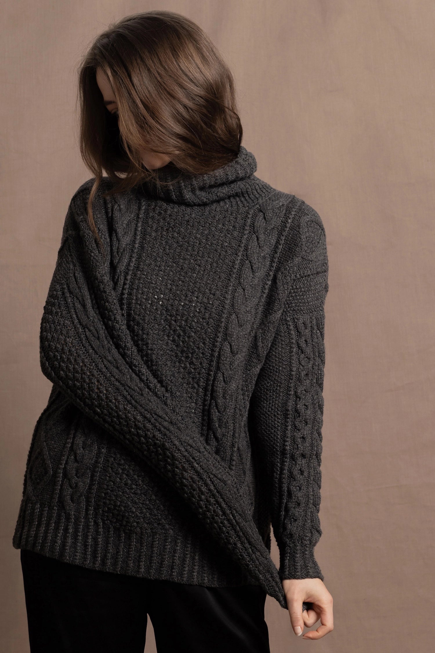 An authentic Irish Cashmere Aran Turtleneck Sweater in Charcoal Grey