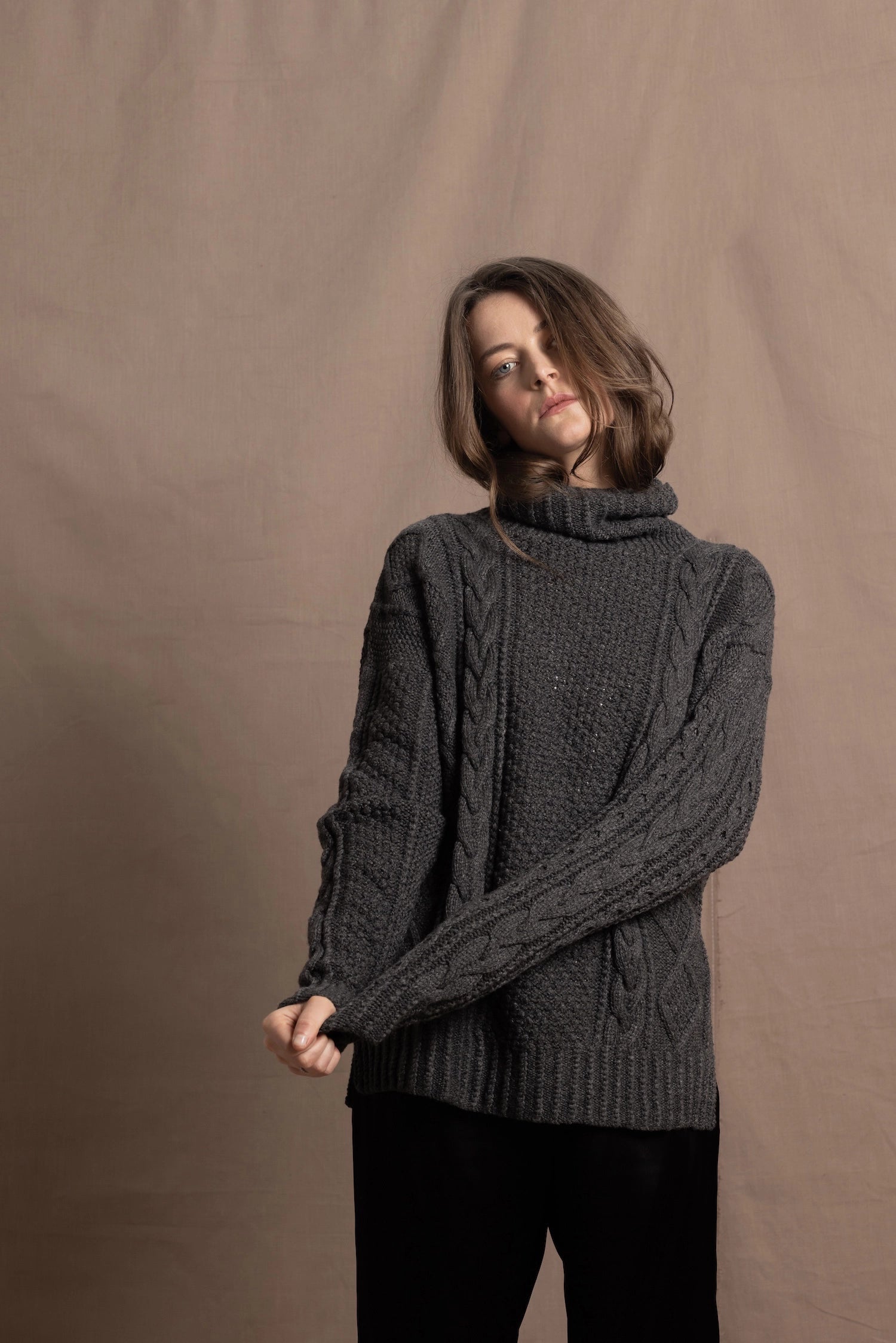 An authentic Irish Cashmere Aran Turtleneck Sweater in Charcoal Grey