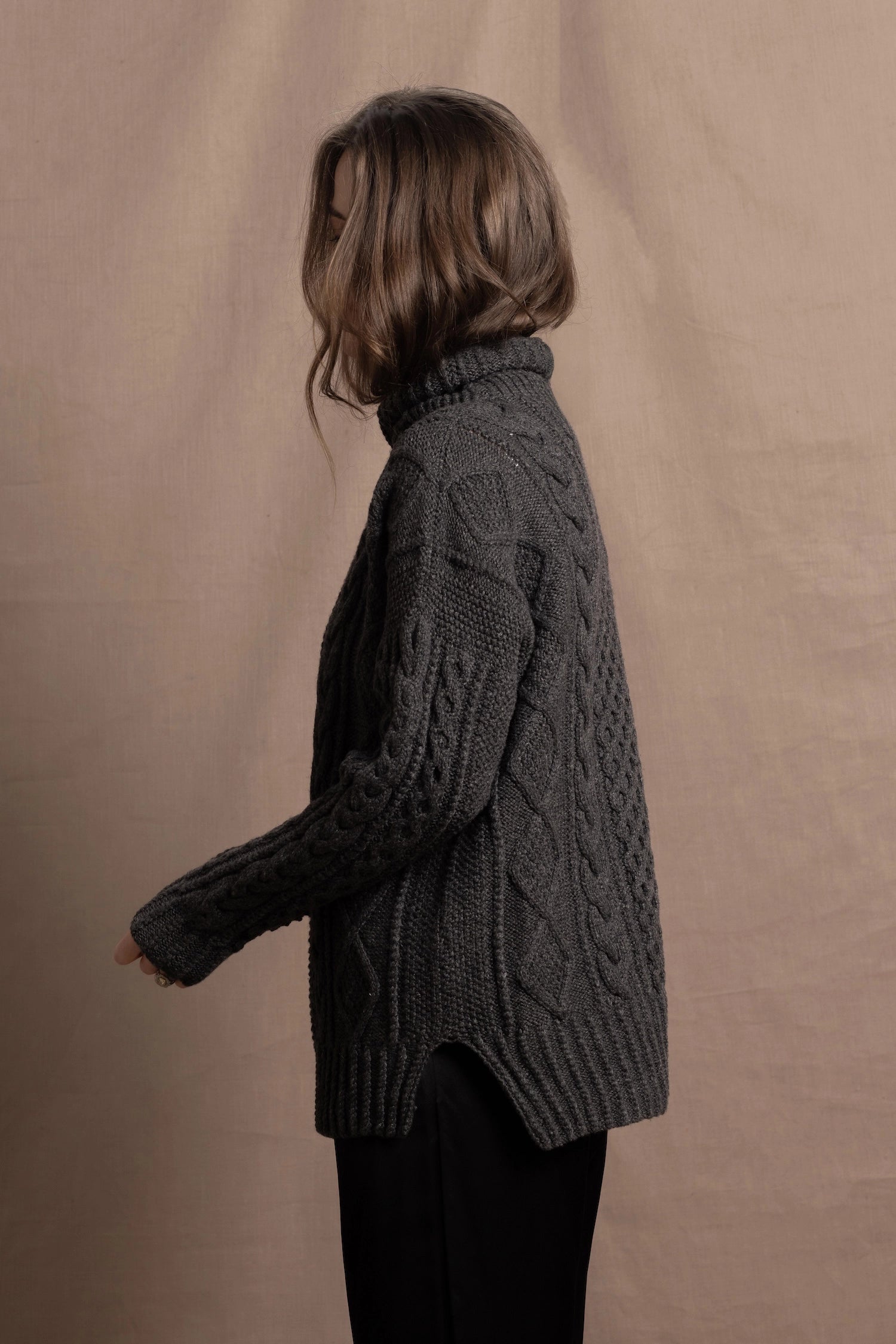An authentic Irish Cashmere Aran Turtleneck Sweater in Charcoal Grey