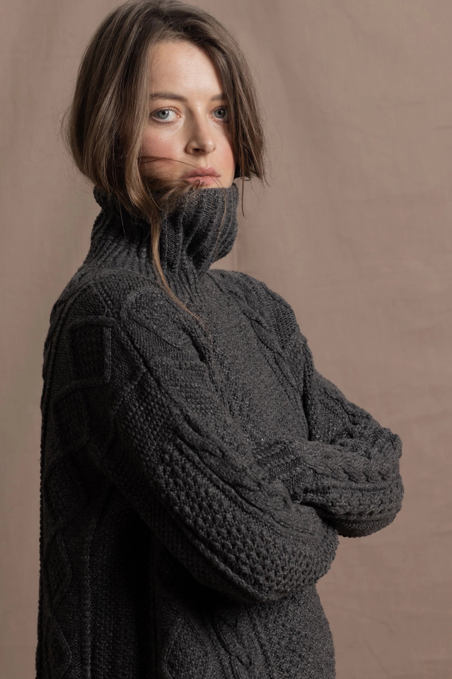 An authentic Irish Cashmere Aran Turtleneck Sweater in Charcoal Grey