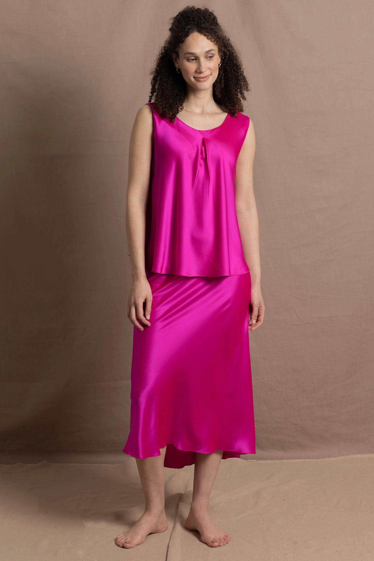 A 100% silk top and skirt in bright shocking pink
