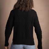 Woman wears traditional Irish Cashmere Aran Sweater in Black