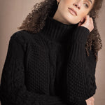 Woman wears traditional Irish Cashmere Aran Sweater in Black