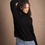 Woman wears traditional Irish Cashmere Aran Sweater in Black