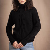 Woman wears traditional Irish Cashmere Aran Sweater in Black