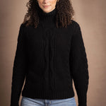Woman wears traditional Irish Cashmere Aran Sweater in Black