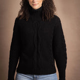 Woman wears traditional Irish Cashmere Aran Sweater in Black