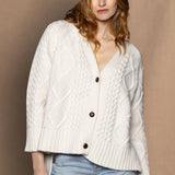 An oversized button down Cashmere Aran Cardigan Sweater in Cream