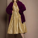 gold silk dress with burgundy cardigan
