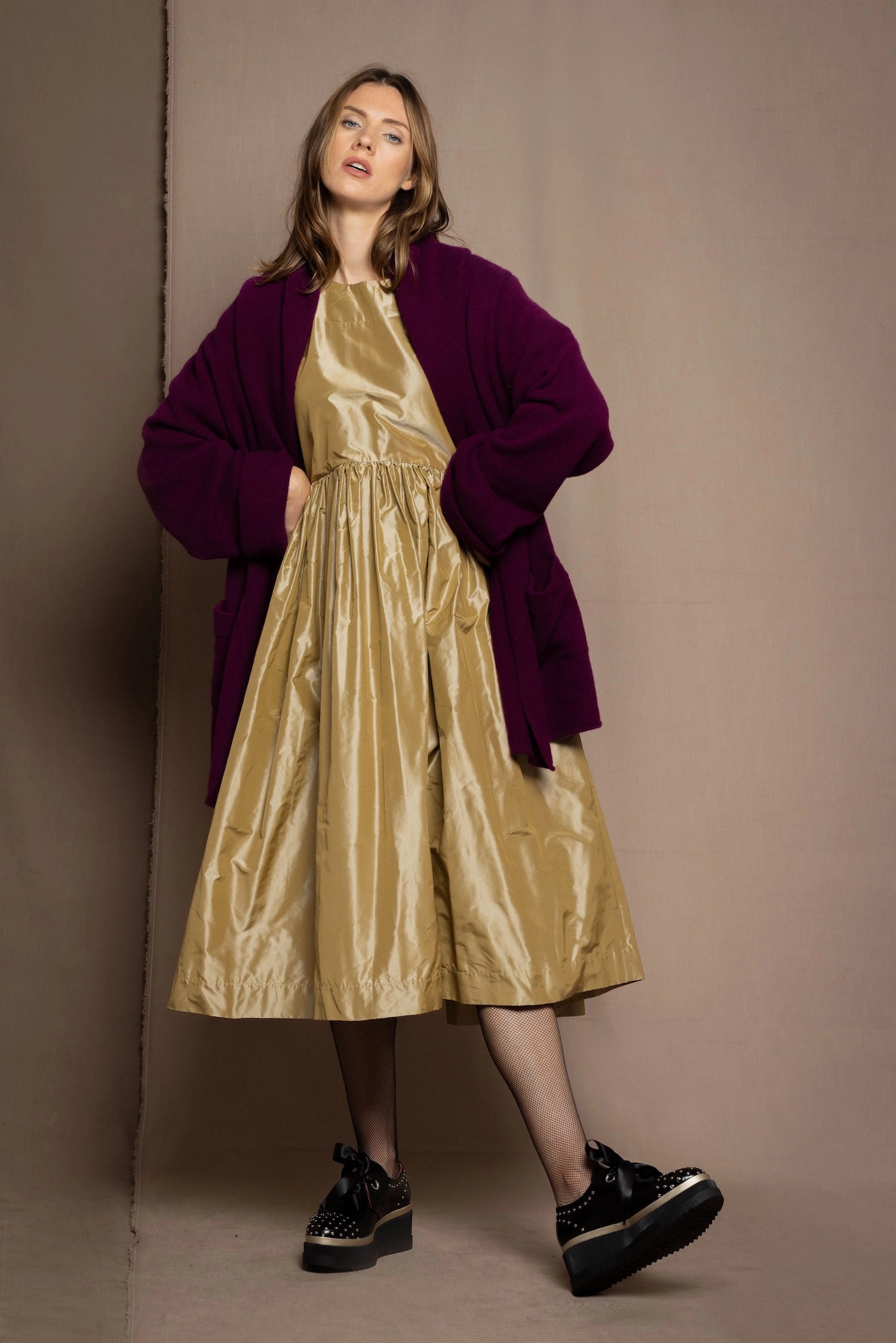 gold silk dress with burgundy cardigan