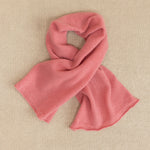 a small dusty pink cashmere scarf