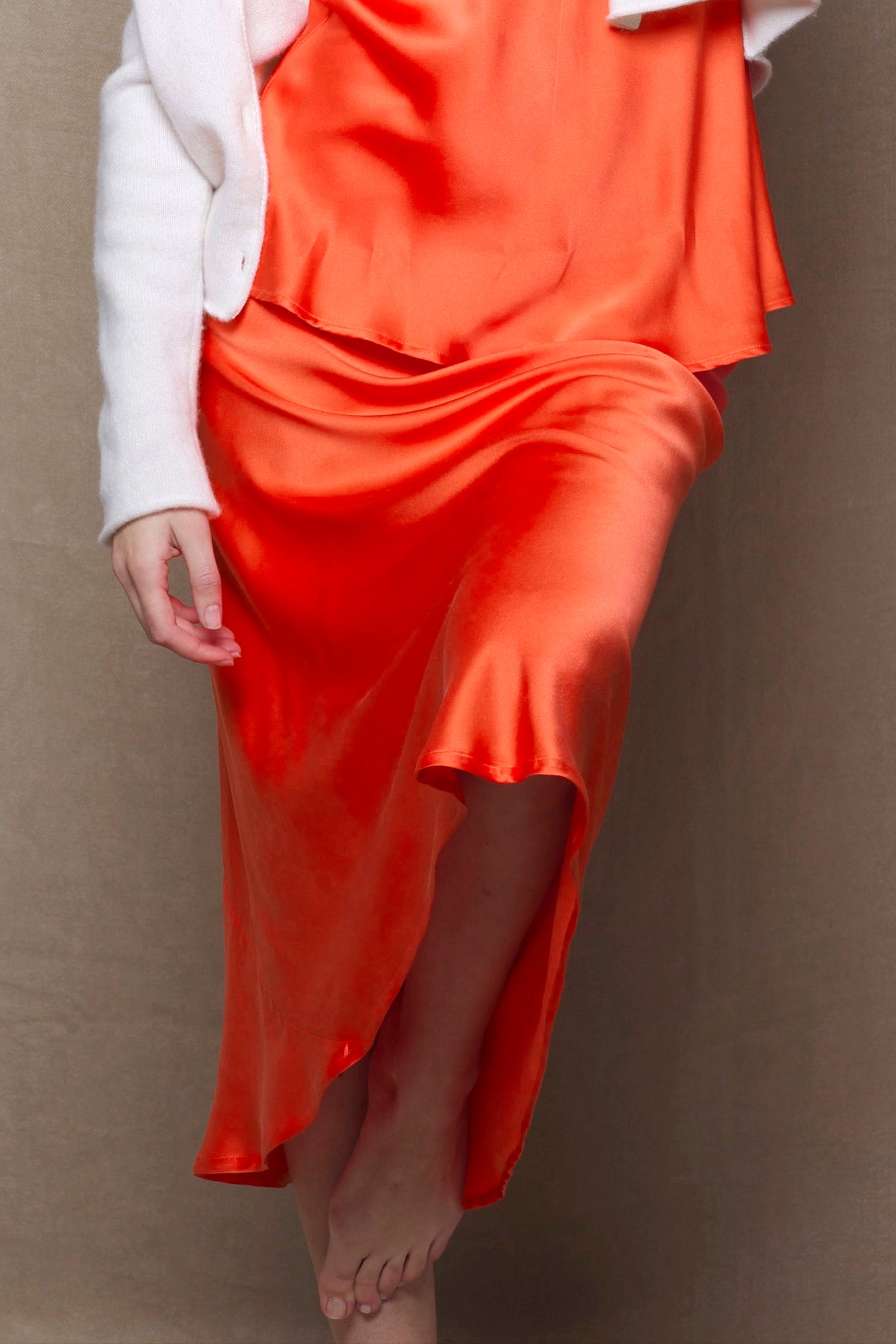 a pure 100% silk midi skirt in bright orange