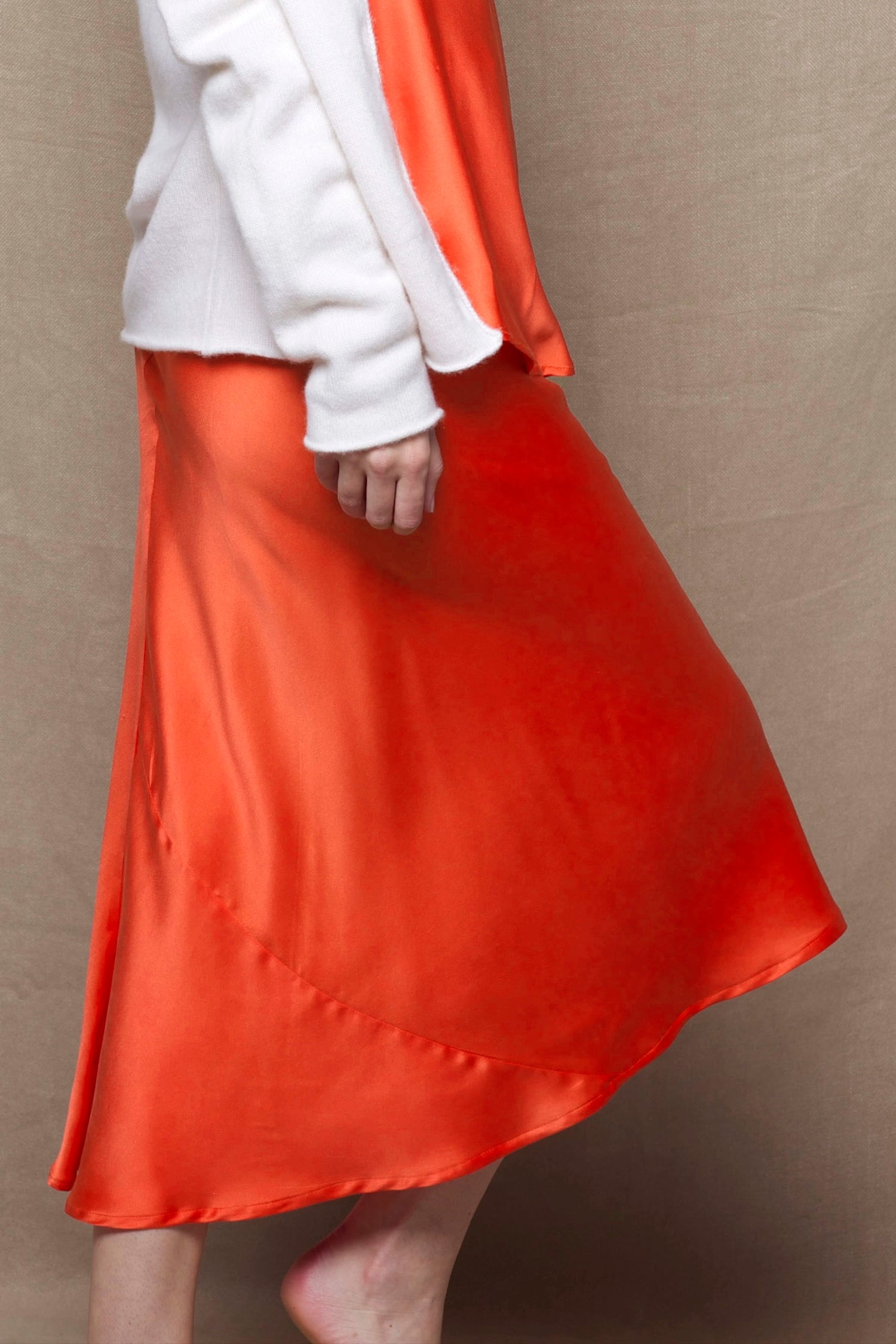 a pure 100% silk midi skirt in bright orange