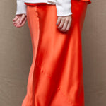 a pure 100% silk midi skirt in bright orange