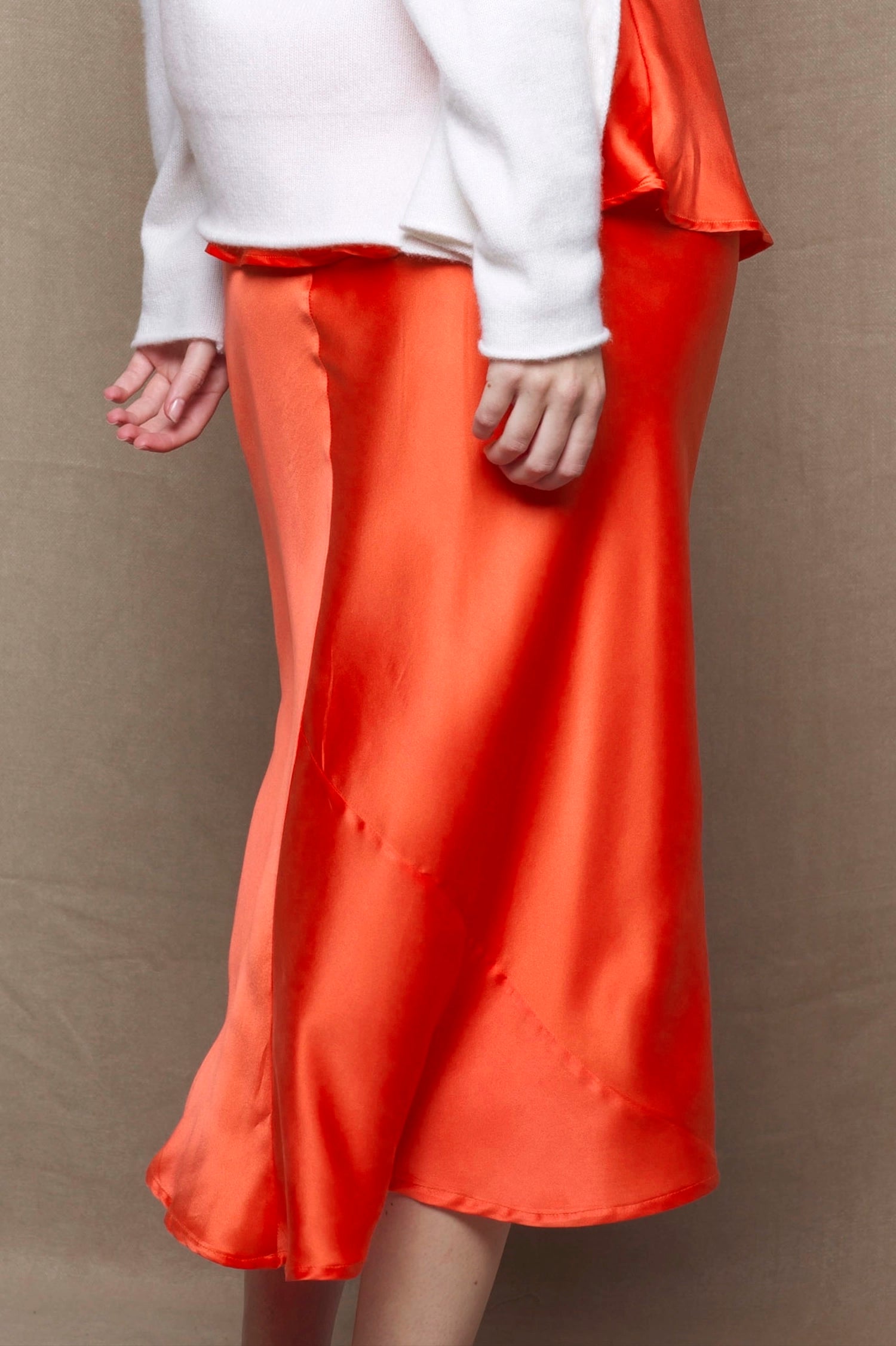 a pure 100% silk midi skirt in bright orange