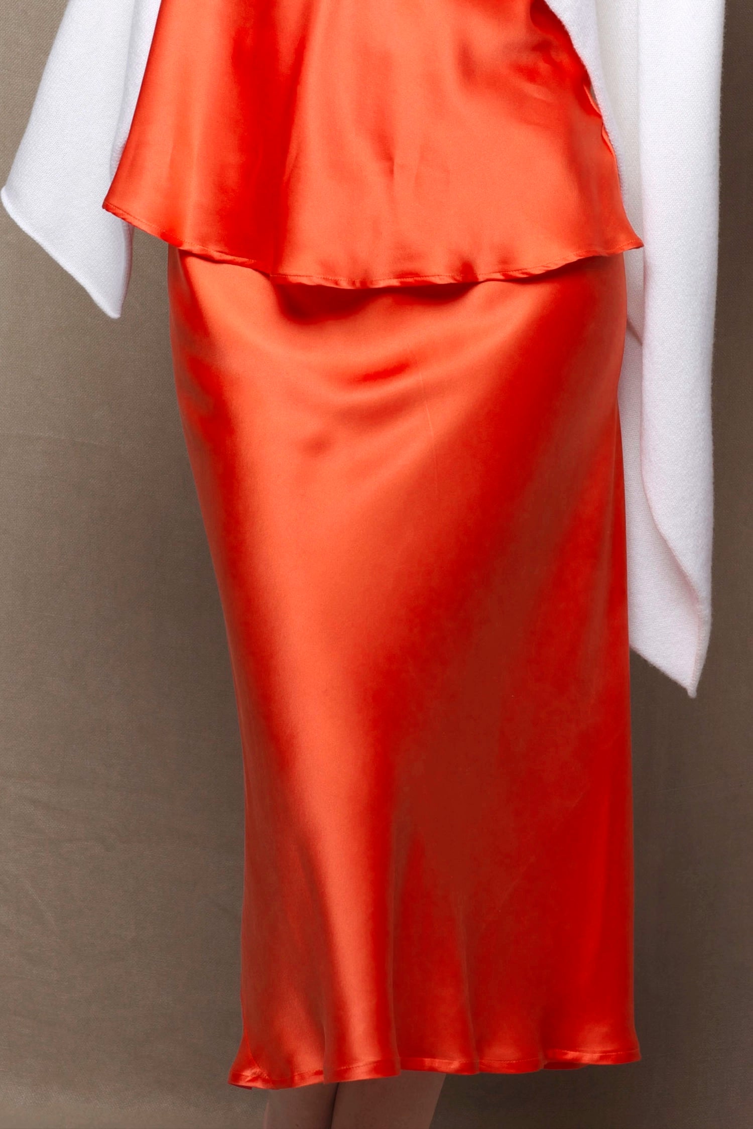 a pure 100% silk midi skirt in bright orange