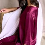 video of a 3/4 sleeve silk blouse in burgundy with matching trousers and large pale pink cashmere wrap