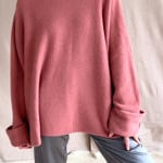 a cashmere oversized pink terracotta sweater with pewter grey silk trousers