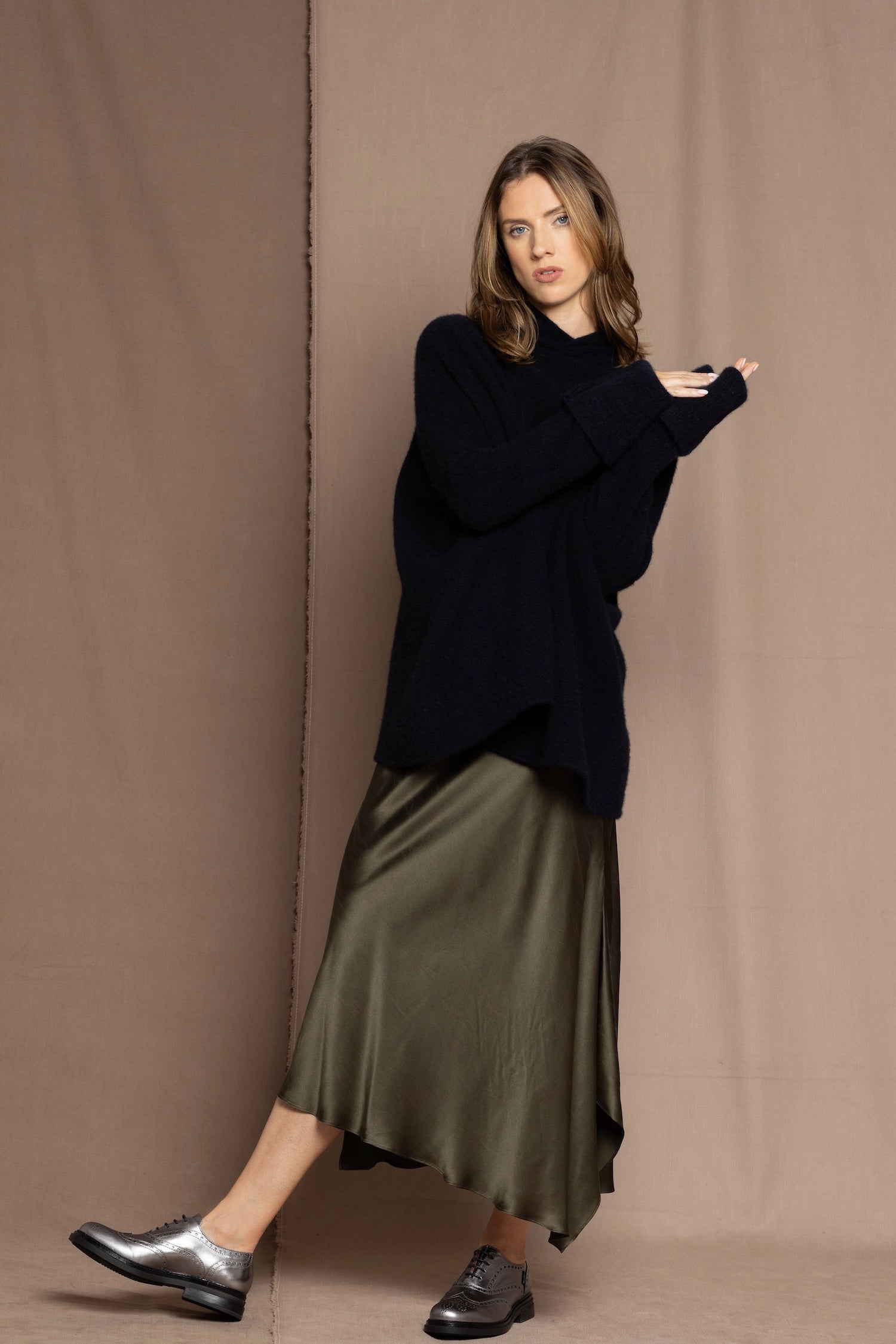green silk skirt and black sweater