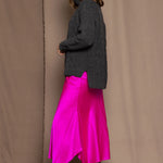 Cashmere Aran Sweater in Grey with a bright pink silk skirt